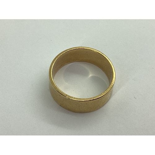 41 - A Wide Plain Wedding Band, unmarked (finger size U) (6.8grams).