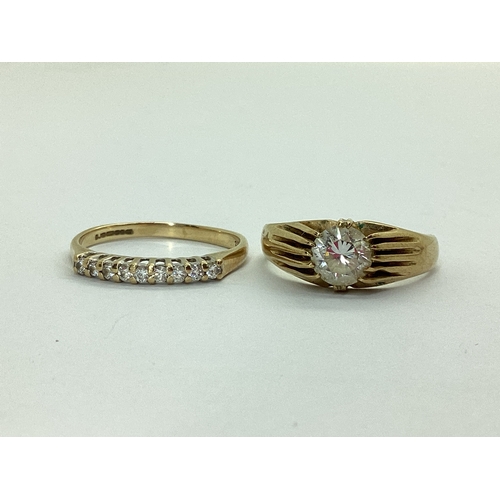 43 - A 9ct Gold Half Eternity Style Ring, claw set throughout, between plain shoulders, stamped 