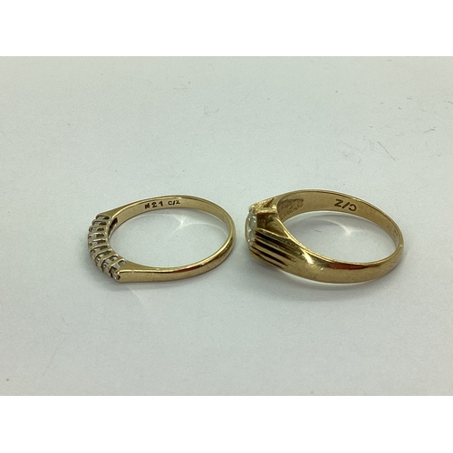43 - A 9ct Gold Half Eternity Style Ring, claw set throughout, between plain shoulders, stamped 