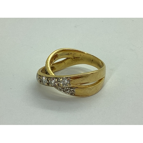 47 - A Modern Diamond Set Dress Ring, of crossover design, stamped 