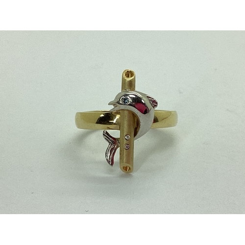 48 - An Unusual Dolphin Dress Ring, with inset highlights, stamped 