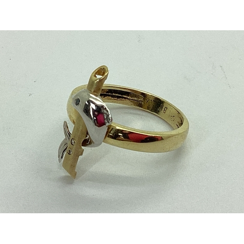 48 - An Unusual Dolphin Dress Ring, with inset highlights, stamped 
