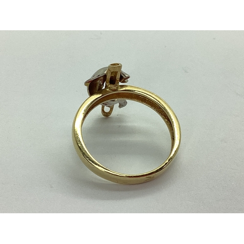 48 - An Unusual Dolphin Dress Ring, with inset highlights, stamped 