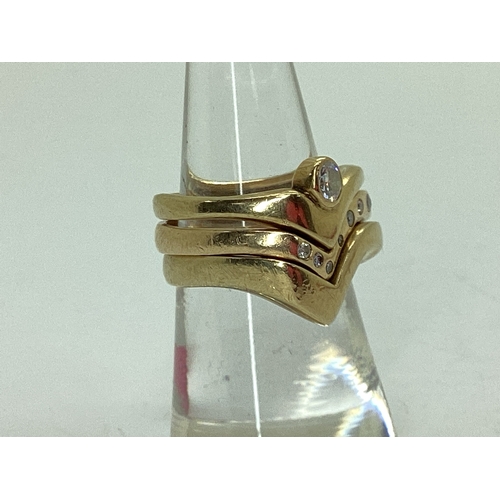 52 - A Bespoke 9ct Gold Three Piece Wedding Band Set, of modern asymmetric wishbone design, consisting of... 