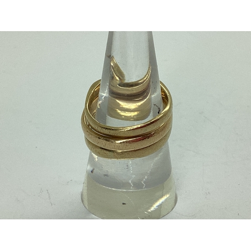 52 - A Bespoke 9ct Gold Three Piece Wedding Band Set, of modern asymmetric wishbone design, consisting of... 