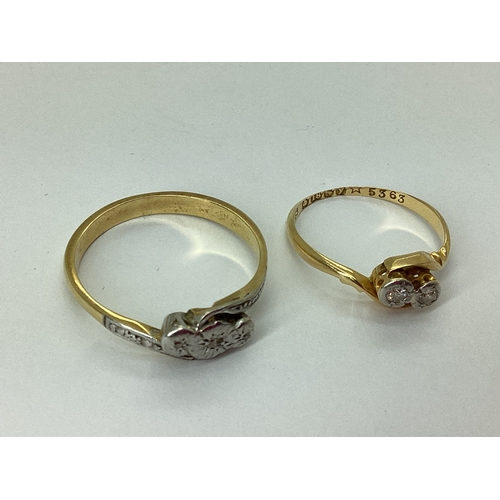 53 - A Dainty 18ct Gold Two Stone Twist Ring, illusion set, on a plain twisted band (worn thin) (finger s... 