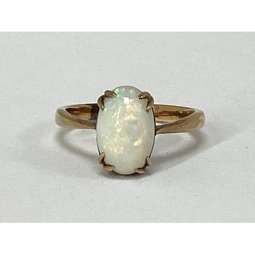 54 - An Opal Single Stone Dress Ring, oval cabochon claw set, stamped 