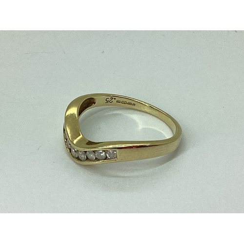 60 - A 9ct Gold Channel Set Diamond Band, of wishbone style, stamped 