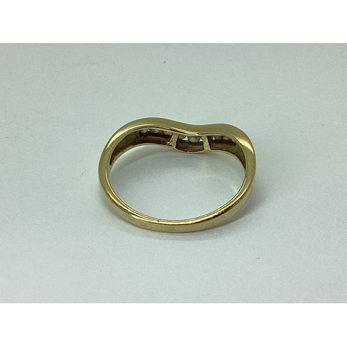 60 - A 9ct Gold Channel Set Diamond Band, of wishbone style, stamped 
