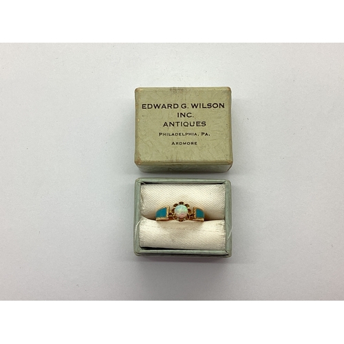 68 - A Dainty XIX Century Opal Single Stone Ring, circular cabochon claw set to the centre, between turqu... 