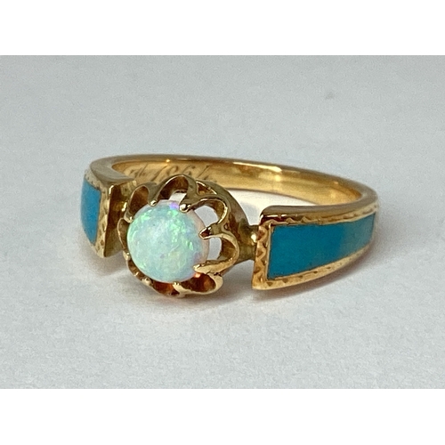 68 - A Dainty XIX Century Opal Single Stone Ring, circular cabochon claw set to the centre, between turqu... 