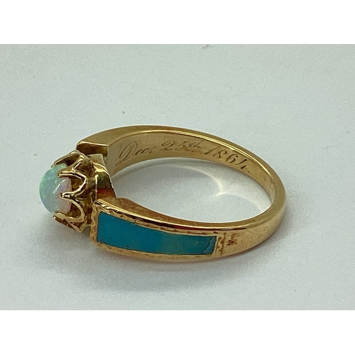 68 - A Dainty XIX Century Opal Single Stone Ring, circular cabochon claw set to the centre, between turqu... 