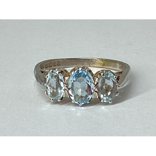 70 - A 9ct White Gold Aquamarine Three Stone Ring, graduated oval claw set, between plain tapering should... 