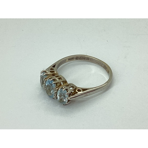 70 - A 9ct White Gold Aquamarine Three Stone Ring, graduated oval claw set, between plain tapering should... 