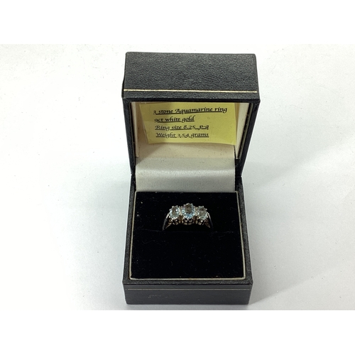 70 - A 9ct White Gold Aquamarine Three Stone Ring, graduated oval claw set, between plain tapering should... 