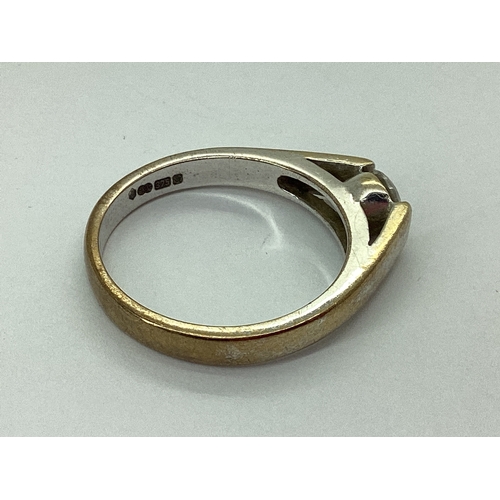 72 - A Single Stone CZ Set Ring, between plain tapered shoulders, stamped 