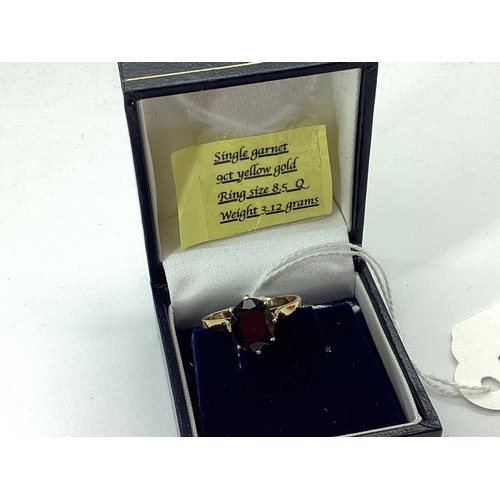 75 - A 9ct Gold Garnet Single Stone Dress Ring, oval claw set high between plain shoulders (finger size Q... 