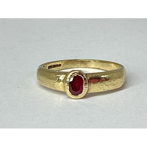 78 - A 9ct Gold Single Stone Set Ring, rubover set (damages), between wide tapered shoulders (finger size... 