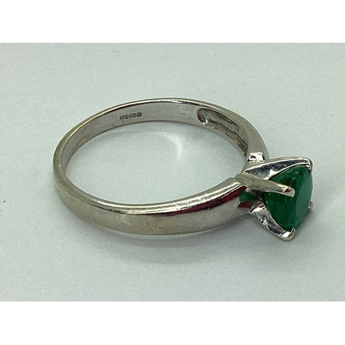 82 - A 9ct White Gold Single Stone Dress Ring, four claw set, between plain tapered shoulders (finger siz... 
