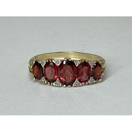 83 - A Victorian Style Garnet Five Stone Ring, graduated set, gilt stamped 
