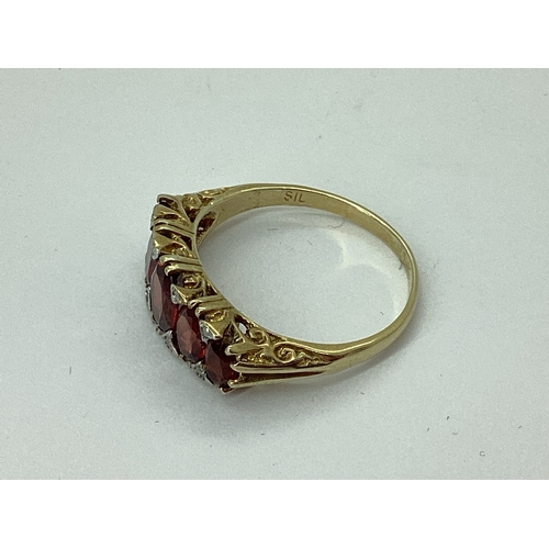 83 - A Victorian Style Garnet Five Stone Ring, graduated set, gilt stamped 