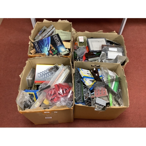 383 - Four large boxes holding the contents of a model railway workshop, including buildings, rolling stoc... 