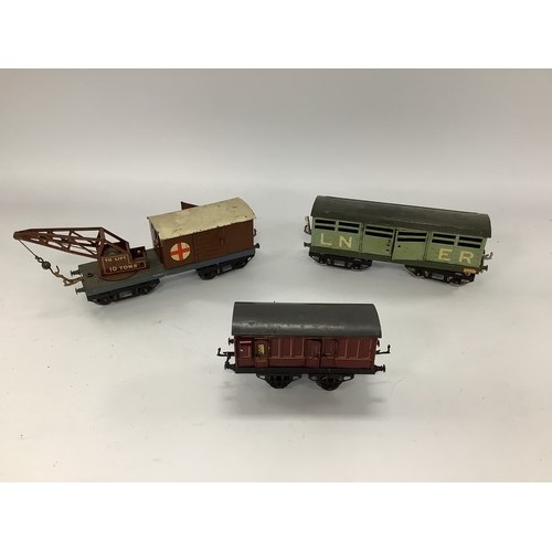 588 - Three 1920s Hornby 'O' Gauge Items of Rolling Stock, a No 2 LMS cattle truck, and NE recovery crane ... 