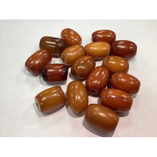 207 - A Vintage Cherry Amber Colour Single Strand Bead Necklace, together with a polished garnet bead neck... 