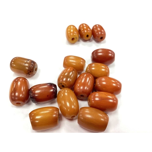 207 - A Vintage Cherry Amber Colour Single Strand Bead Necklace, together with a polished garnet bead neck... 