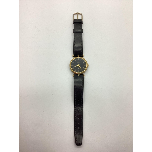 161 - Gucci; A Gent's Wristwatch, the black circular signed dial with Roman numerals, within gilt coloured... 