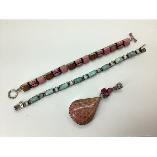 105 - A Large Modern Polished Hardstone Teardrop Pendant, collet set surmount; together with two polished ... 