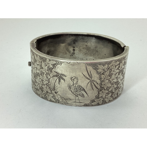 109 - A Victorian Hallmarked Hinged Bangle, Birmingham 1881, leaf engraved to the front with vignette deta... 