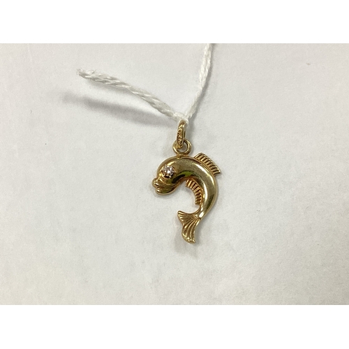 69 - A Novelty Fish Pendant / Charm, claw set eye detail, textured fins and flicked tail, stamped 