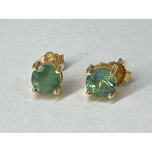 70 - A Pair of Modern Single Stone Earrings, four claw set, to post and scroll fitting. [713235]