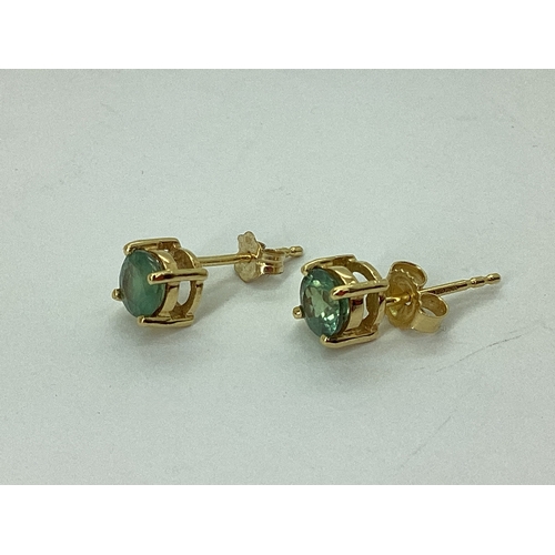 70 - A Pair of Modern Single Stone Earrings, four claw set, to post and scroll fitting. [713235]