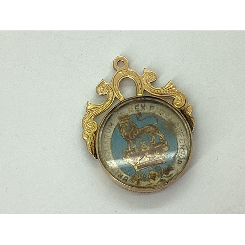 74 - A Late Victorian 9ct Gold Mounted Enamel Coin Fob Pendant, inset with earlier George IV 1826 Shillin... 