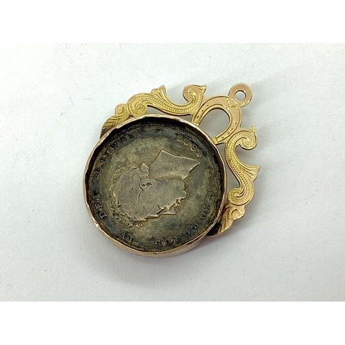 74 - A Late Victorian 9ct Gold Mounted Enamel Coin Fob Pendant, inset with earlier George IV 1826 Shillin... 