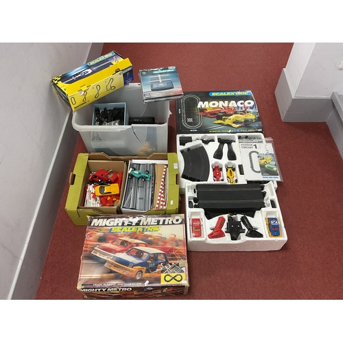 410 - Scalextric interest to include Mighty Metro and Monaco slot car sets, four unboxed slot cars, track,... 