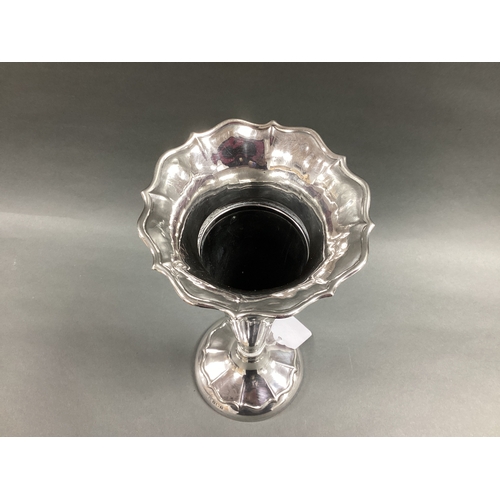 10 - A Hallmarked Silver Trumpet Vase, Birmingham 1914, plain tapering stem below shaped flared rim, on c... 