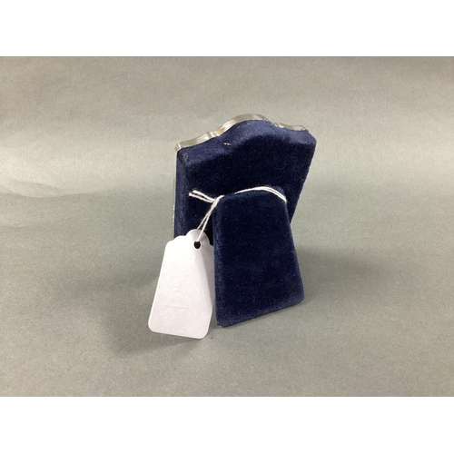 13 - A Modern Carrs Hallmarked Silver Mounted Bedside Clock, of shaped design, on plush easel back, 9cm h... 