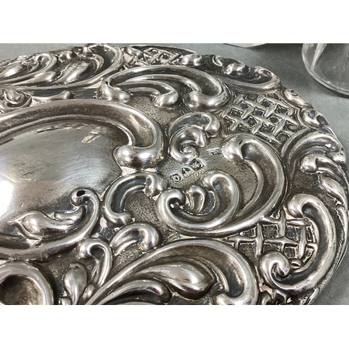 45 - A Chester Hallmarked Silver Backed Hand Mirror, William Neale, 1899, foliate scroll relief throughou... 