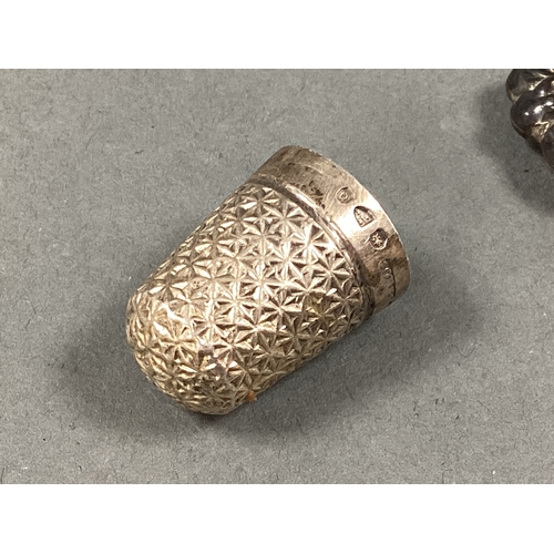 56 - A Chester Hallmarked Silver Thimble, textured throughout, together with a desk seal, vacant, with sc... 
