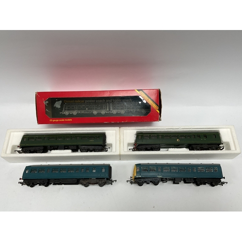 511 - Two Triang two-car diesel multiple units: one in green, boxed (underframe detail missing from power ... 