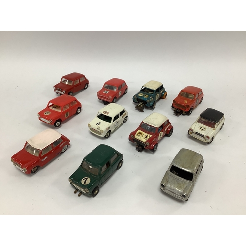 580 - Eleven 1:32 scale slot cars. All Minis. Many modifications and adaptations noted, small parts may be... 