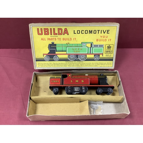 877 - A 1950s Ubilda Tinplate Locomotive, by Chad Valley. Built up, boxed. Missing instructions.