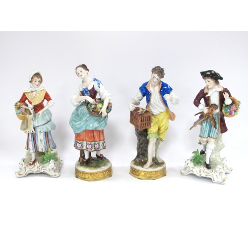 1254 - Pair of Sitzendorf Figurines of Flower Sellers together with a boy with a bird on a basket, 19cm tal... 