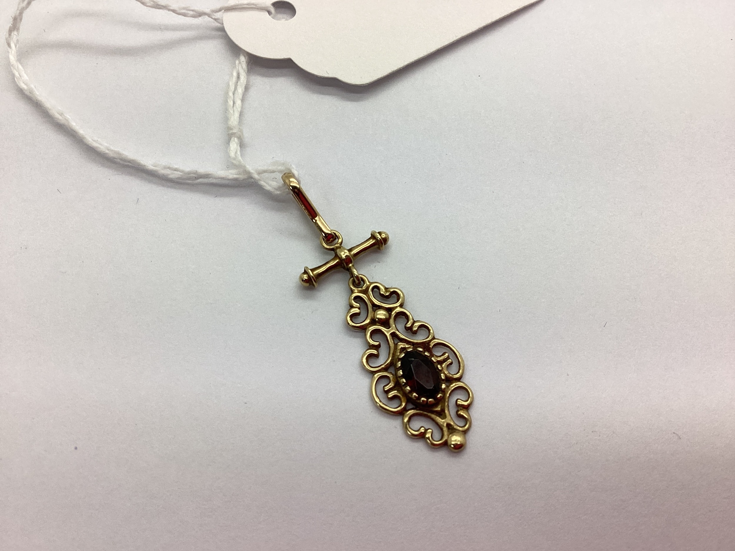 A Victorian Style Drop Pendant, oval collet set within scroll border ...