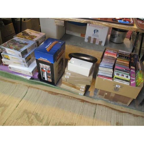 100 - Two Boxes of CDs, Collectors Plates, Jigsaws, Savings Bank etc