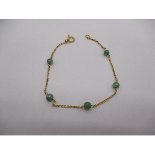 518 - 585 Gold and Jade Bracelet, 1.9g