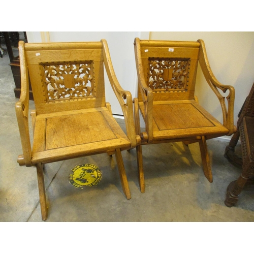 Pair of Wylie & Lochhead Oak Savonarola X-Frame Chairs